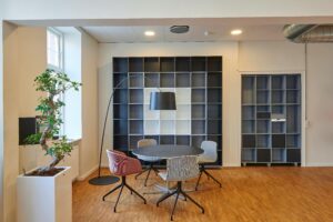 Home Bright and stylish office space with contemporary furniture and open shelving.