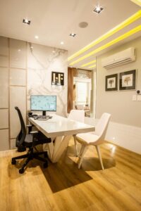 Home Elegant modern office interior featuring a sleek desk, chairs, and ambient lighting for a sophisticated environment.